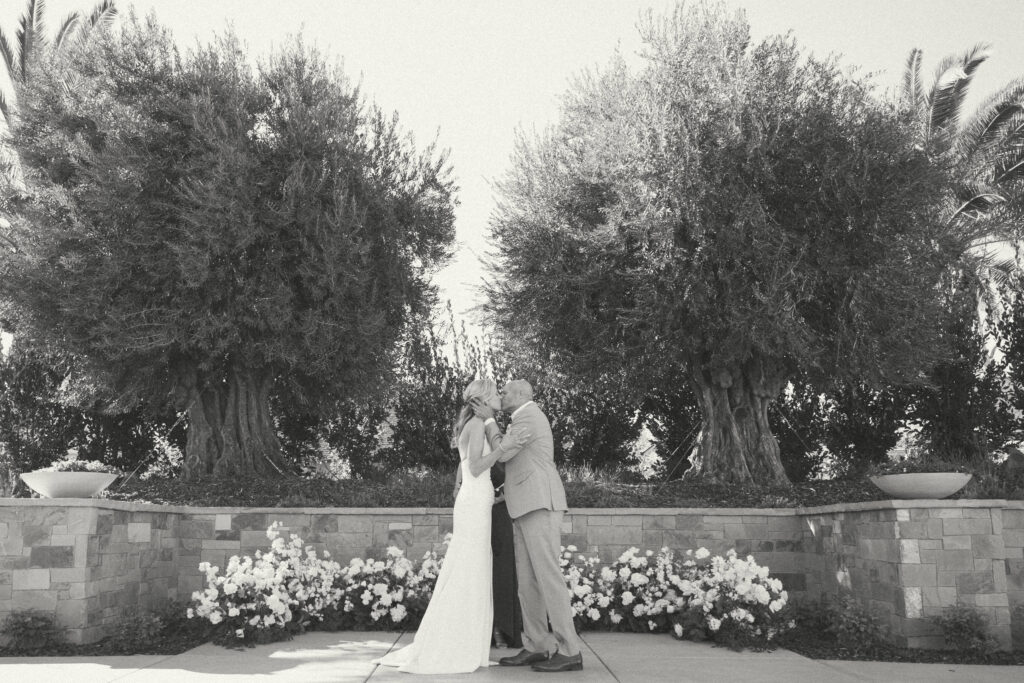 Bride and groom kissing at alter at solage in calistoga california