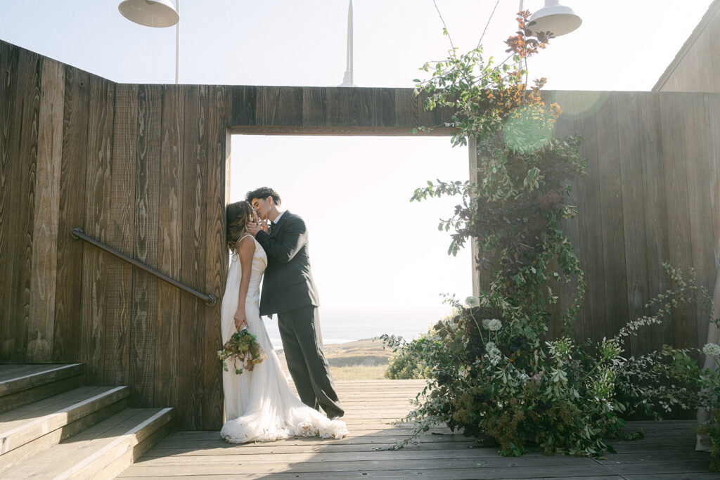 couple kissing on walkway at Sea Ranch Lodge