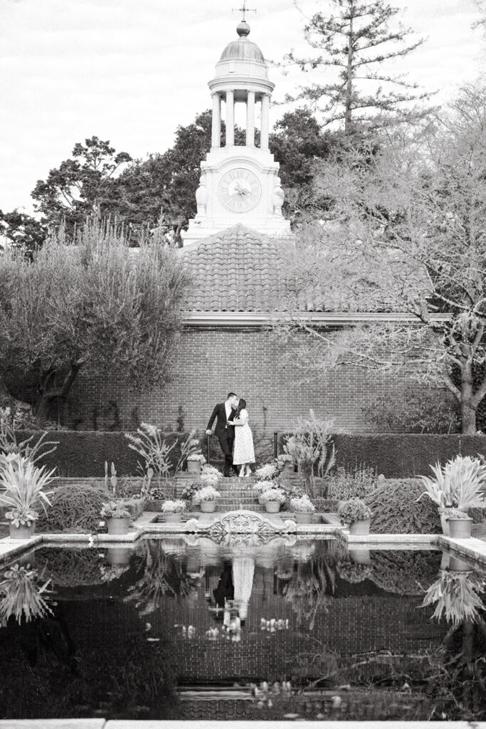 Couple kissing near pond at Filoil Gardens